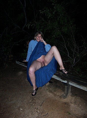 The image shows a bitchy broad with her legs spread open, exposing her twat.