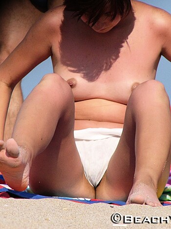 "Here's a bitch titties with a pussy mouth sitting on some sand."