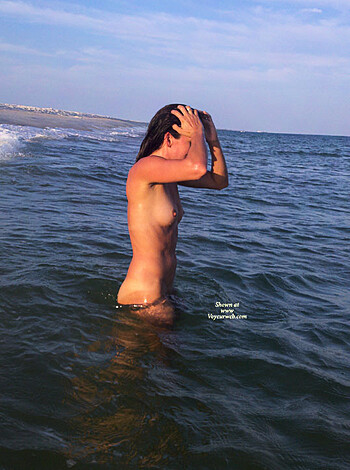 "
Here's a fucking hot bitch in the motherfucking ocean with her fat tits and shaved snatch out in the open for all you perverts to fucking see."