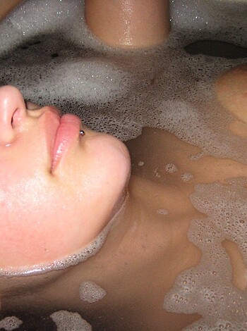 "Fucking hot chick soaking in bubbly tub full of fucking soap."