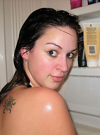 A fucking hot babe soaking wet naked with water all over her body, her tits and pussy fully exposed as she's sitting on the edge of the tub with her legs spread wide open waiting for some cock to come inside her dripping wet pussy.