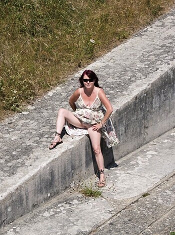 Whoring her ass off on the fucking brick shithouse with her tits spilling out of her top like two sweaty, man-pleasing melons.