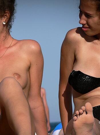 A nude chick's tits bouncing on the shore.