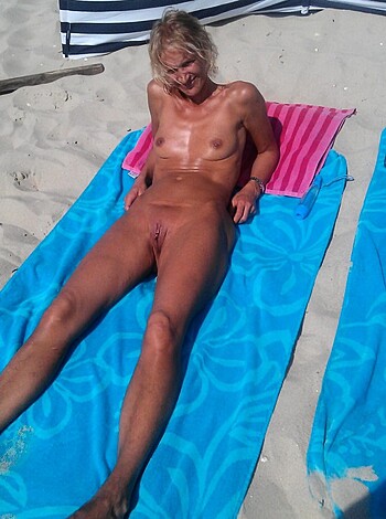 "Check out this fuckin' hot chick spreading her sexy ass cheeks on a beach towel, bro!"
