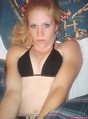 "Check out this hot chick in a bikini top lying nude on a bed."