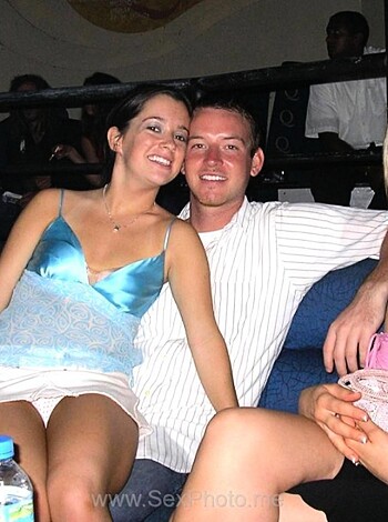 A fat assed broad with tits hanging out sits next to some dude at the bar, while her equally fucking fugly friend gives him a cheesy smile from across the table.