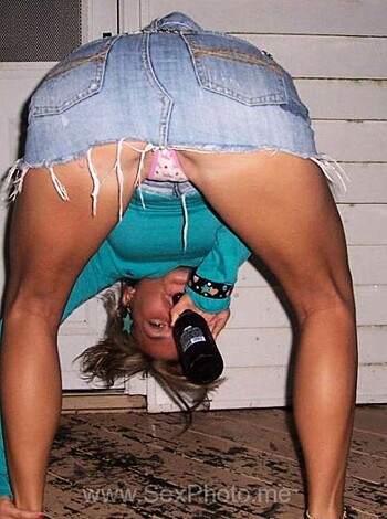 A hot ass chick with tits hangin' out is gettin' wasted and flashin' her panties, all in one damn shot.
