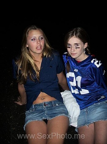 Two fucking chicks in tight ass football jerseys gettin all sweaty and shit, with their tits bouncing around like a goddamn pendulum.