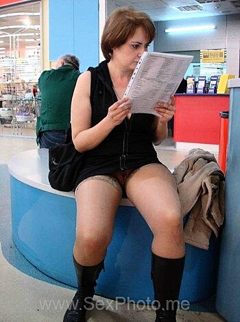 Here's a naked chick with boots on, sittin' her ass down.