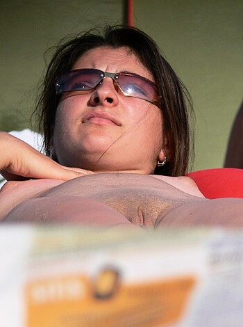 "Bare-assed babe on the sandy shore, spreadin' her legs wide open for the world to see."