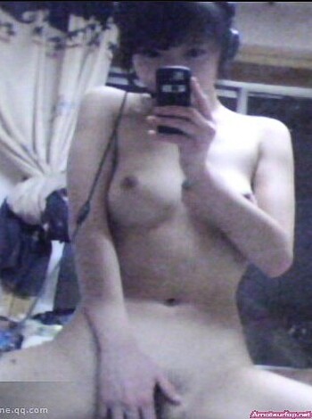 This bitch is taking a dick pic while playing with her titties and showing off her ass in front of the camera.