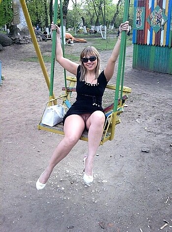 """
A fuckin' hot chick sits on a sexy swing with her legs wide open, flashing her pussy, smiling and posing for the camera.
"""