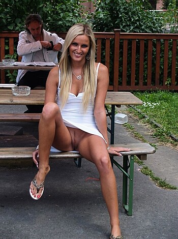 """
Brunette woman sitting on a bench at the fucking park with her giant tits hanging out of her shirt like a goddamn whore.
"""