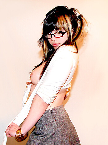 Here's the vulgar description of the image: "Fucking hot chick with tits and nipples, rocking some glasses."