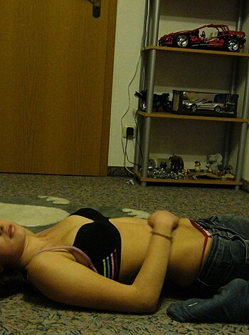 Fucking chick with tits out, sittin' on some fucking rug.