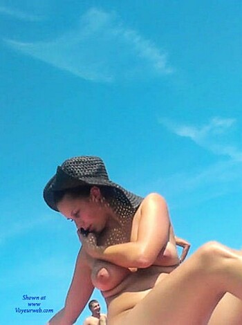 Here's a picture of some slutty bitch blowing some dude's dick on the sandy shores of the beach, get your fucking eyes off her tits and watch the water you asshole.