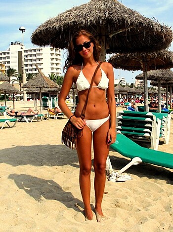 "Here's a picture of some hot slut in a skimpy bikini straddling her tits on the fucking beach with a smug look on her face."