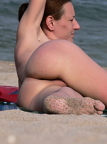 "Yo, check out this picture of some hot ass bitch sittin' on a fucking towel on the beach with no goddamn clothes on, motherfucker! Don't forget to stare at her back and ass while you cum in your pants, asshole!"