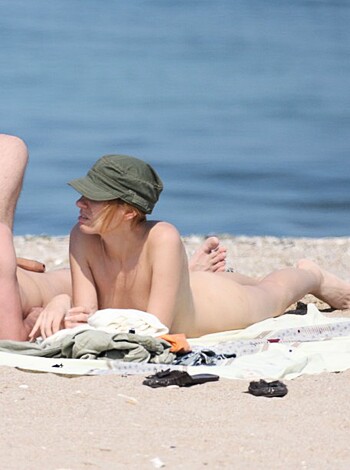 The fuckin' idiots are soaking up some goddamn rays by the ocean.