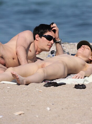 A d*ck and a p*ssy basking on the sand while playing in the surf, their cocks hanging loose, dicks flopping around with every wave that crashes over them.