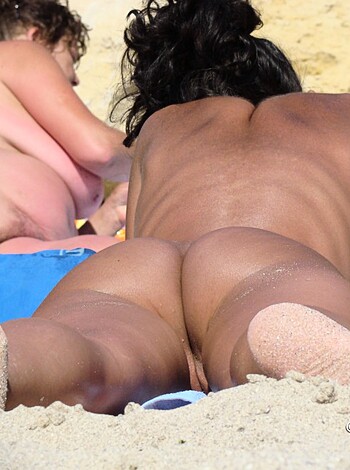 "Yo, check out this bitch in her tight-ass thong on the fucking beach, dudes."