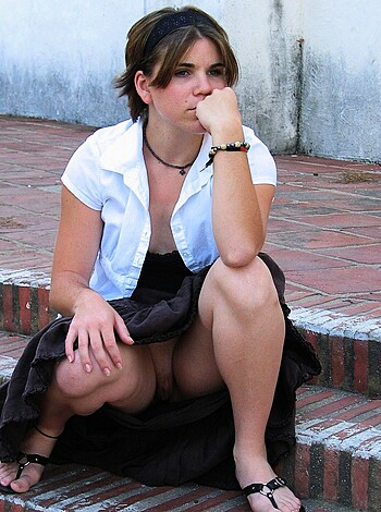 "Hey dudes, check out this pic of some hot babe with her fucking skirt hiked up high enough to give us a nice view of those sexy panties, while she's also rockin' some sweet jewelry. Fap material for sure."