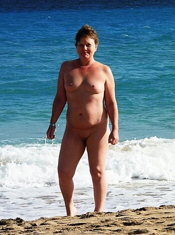 "Here's a fucking picture of some busty slut strutting her knockers on the sandy shores."