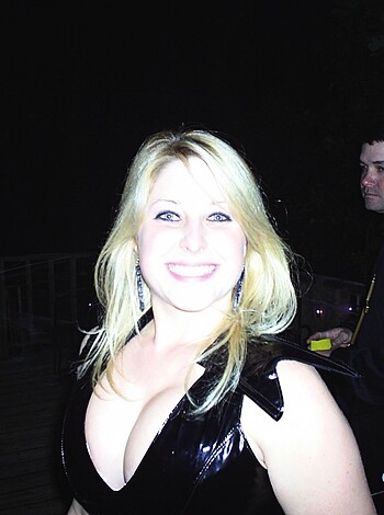 "Here's a fucking pic of some hot bitch dressed all in black, with her pouty lips stretched out wide like she's got a cock up her ass."