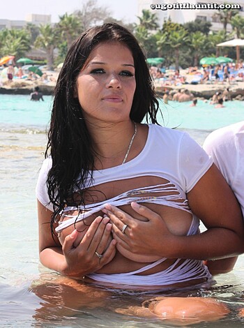 "Here's your typical beach bitch, tits out, ass out, posing like a fucking idiot while dipping her fat pussy into the goddamn ocean."