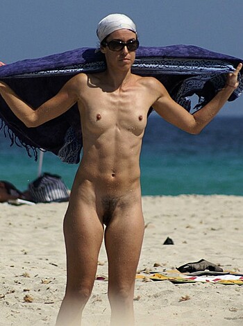 """
Busty chick showing her boobies on the sandy shore.
""