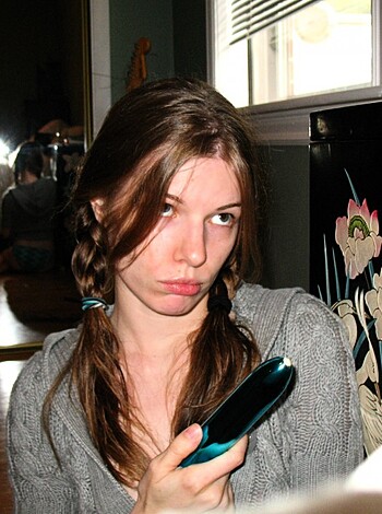 A bitch is painting her fucking nails like a slut.