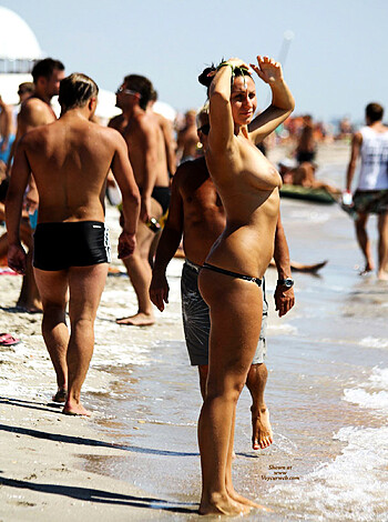 Here's a bitchy hoe with a skimpy swimsuit on a fucking sandy shore, motherfucker.