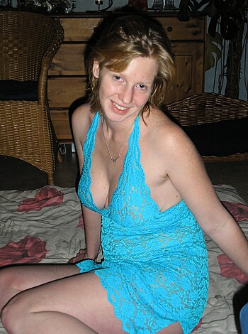 "A slutty chick is posing on the sofa in her lacy blue bitch dress, giving you a hint of panties. Fucking look at that shit."