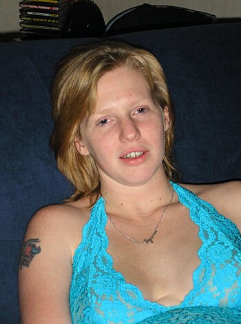 """
Here's a hot chick in a tight blue bra, her tits spilling out the sides like melons. 
"""