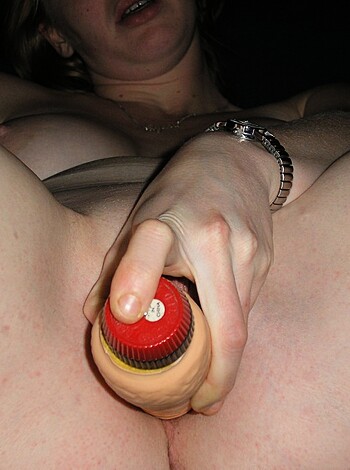 """
A bitch using a dildo on her pussy.
"""