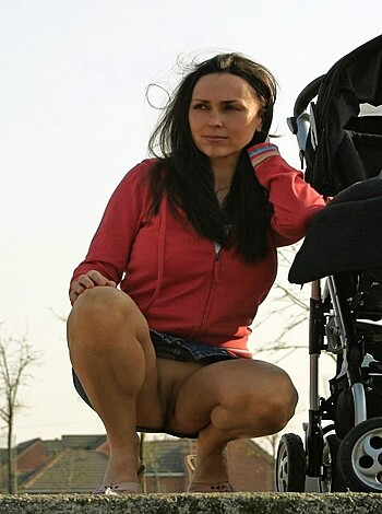 A fucking bitch with a fine ass sits on some goddamn stairs.