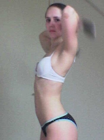 "Here's a skinny teenage chick in a small swimsuit, flexing her meager muscles while holding up a pair of dumbbells."