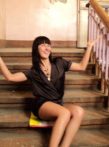 "Check out this fuckin' bitch sittin' on some fuckin' stairs, all dressed up in a black motherfuckin' dress, with her tits hanging out like a slut, givin' us a big smile like she ain't got no goddamn problems."
