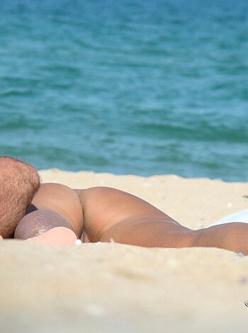 Dudes layin' ass-to-ass on the sandy shoreline, completely nekkid as fuck, bro!