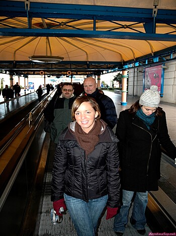 "Hundreds of pedestrians strolling down the pavement."