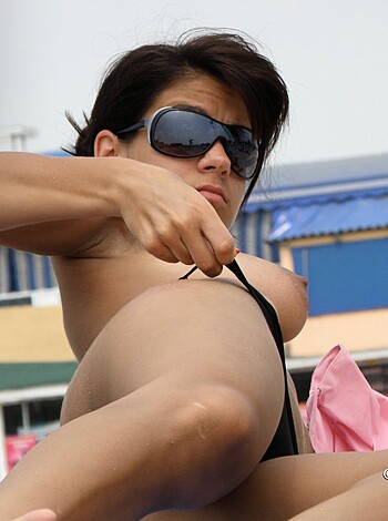 "Dude, check out this hot chick lying ass-up on a yacht, tits flapping in the breeze while she rocks some shades."