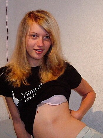 Vulgar Description: Look at those massive fake tits on that bitch! She doesn't even have a shirt on!