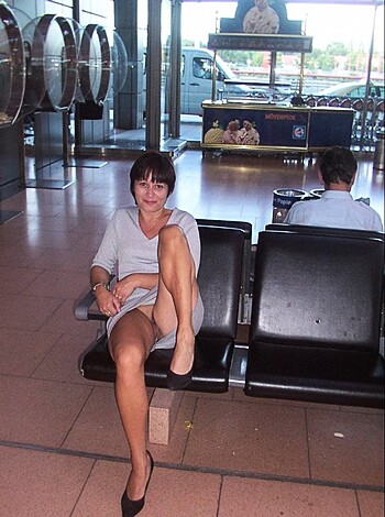 """
Hot babe showing off her bare thighs and sexy high heels.
"""