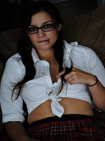"""
Babe's brassiere straps are undone and apparent.
 """