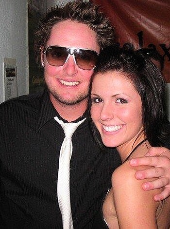 Look at this fucking picture of some dumb assed couple, where the stupid bitch is wearing a damn bikini top.
