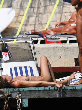 A fuckin' beachescape with all sorts of bums, cocks, and tits out for the world to see.