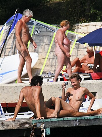 """
A fucking bunch of naked people with sandy dicks and bushes at a shithole of a beach bar, surrounded by drunk assholes who can't keep their eyes off the tits and asses.
"""