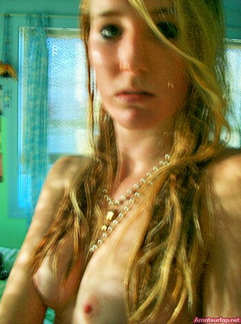 "Here's a shot of some busty blonde chick with her tits out, wearing a fucking expensive-ass gold bracelet."