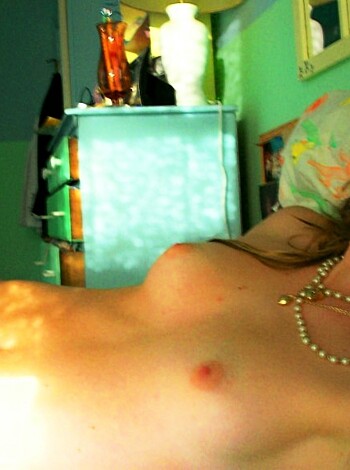 Vulgar Description: "Here's a pic of some slutty whore who probably got fucked senseless last night, laying naked on a goddamn bed with her tits out and shit."