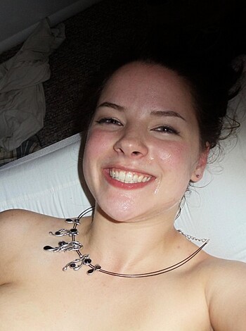 "Here's a photo of some naked chick laying on her back with a goofy grin, enjoying herself while the camera snaps away."